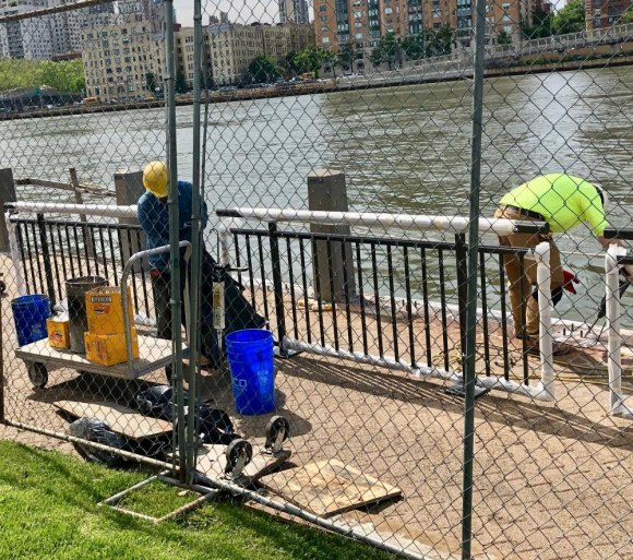 RIOC Racing To The Finish Line For FIGMENT NYC In Lighthouse Park A crew is busy working on new seawall railings before crowds begin walking up to Lighthouse Park for FIGMENT NYC 2019.
